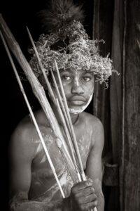 A man with a beard and a wreath on his head.