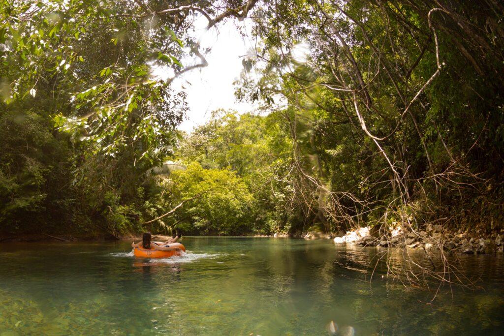 Cave and river tubing in the Cayo District of Belize. Model Released woman