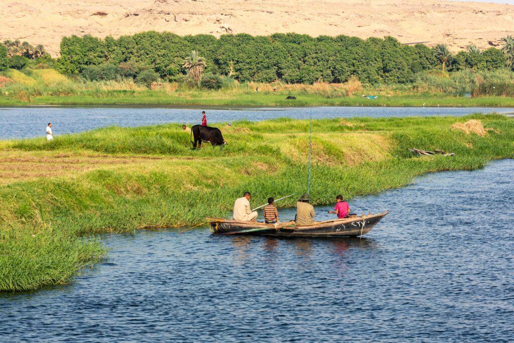 Men fishing from a small boat in the Nile.