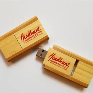 Two wooden USB flash drives with red text.